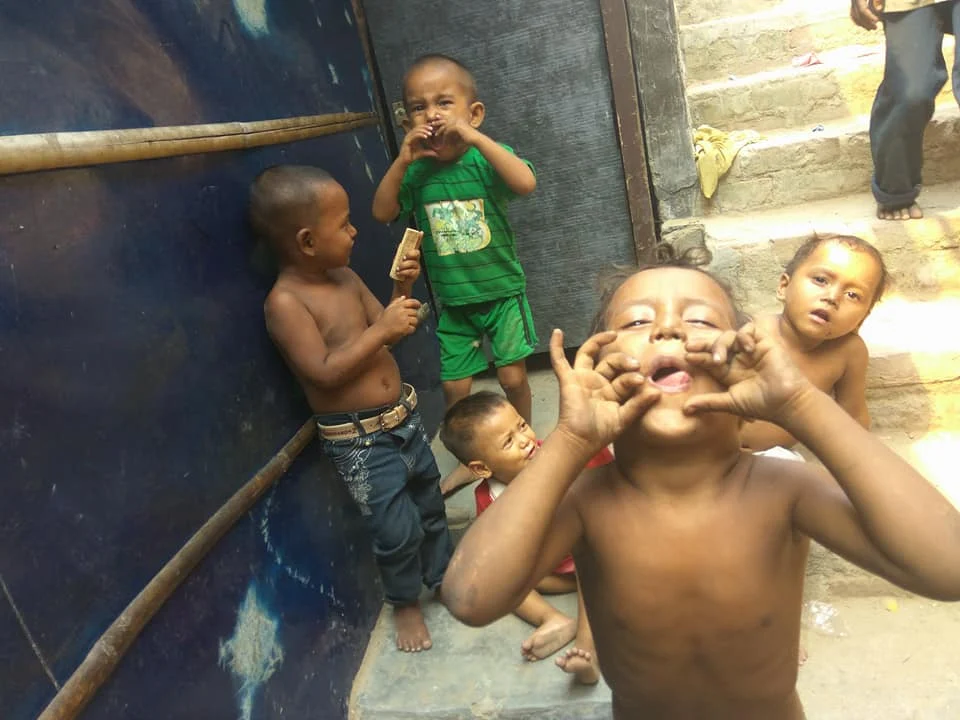 Children playing outside in a community setting.