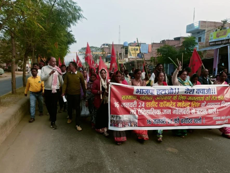 Protesters marching with banners and flags on street