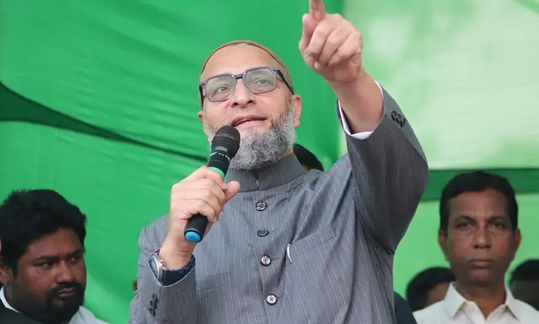 Man speaking at rally with microphone.