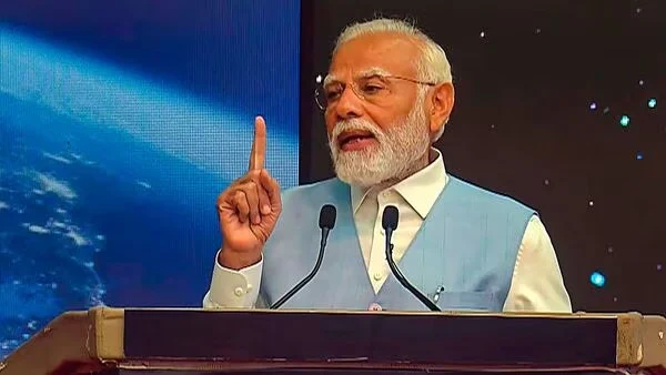 Man giving speech at podium with microphone.