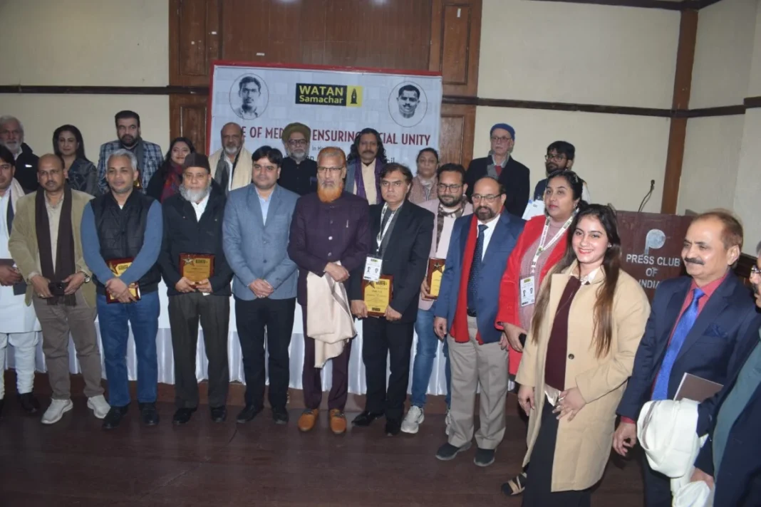 Group of people posing with awards at an event.