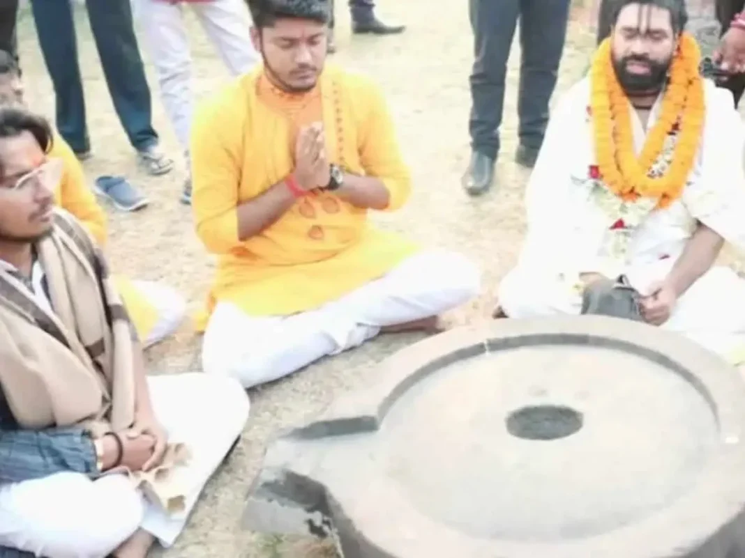 People participating in a traditional ceremony outdoors.